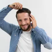 adult-male-brushing-his-hair - Hair 4 Life Medical Hair 4 Life Medical - Dr. Kelemen